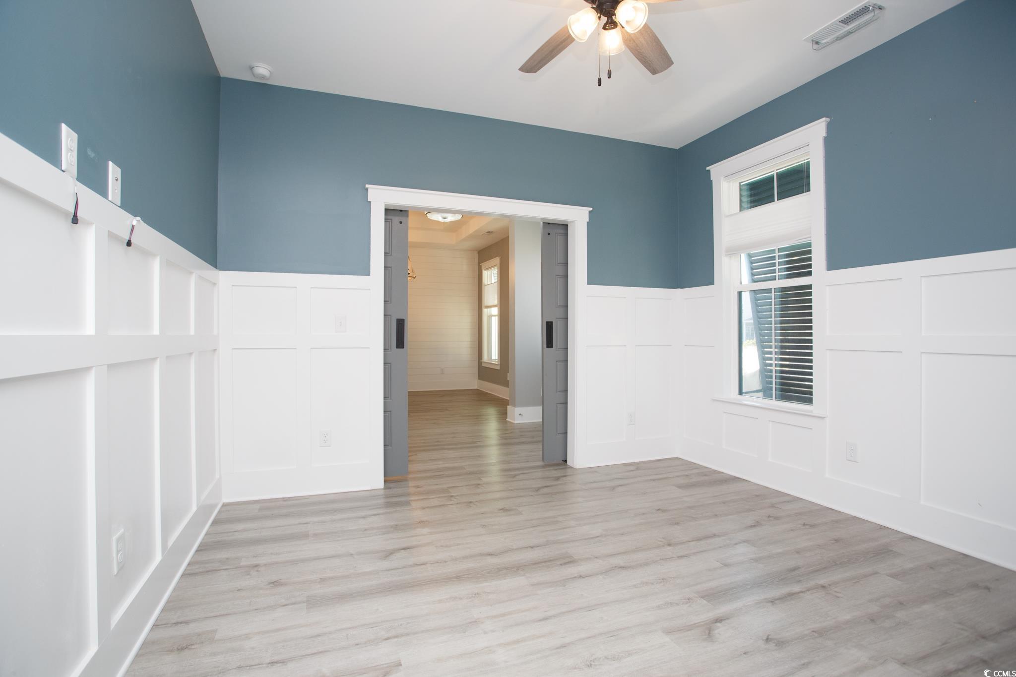 261 Marsh Tacky Loop Myrtle Beach, SC 29588 - Photo 29 of 40 Empty room featuring light hardwood / wood-style flooring and ceiling fan