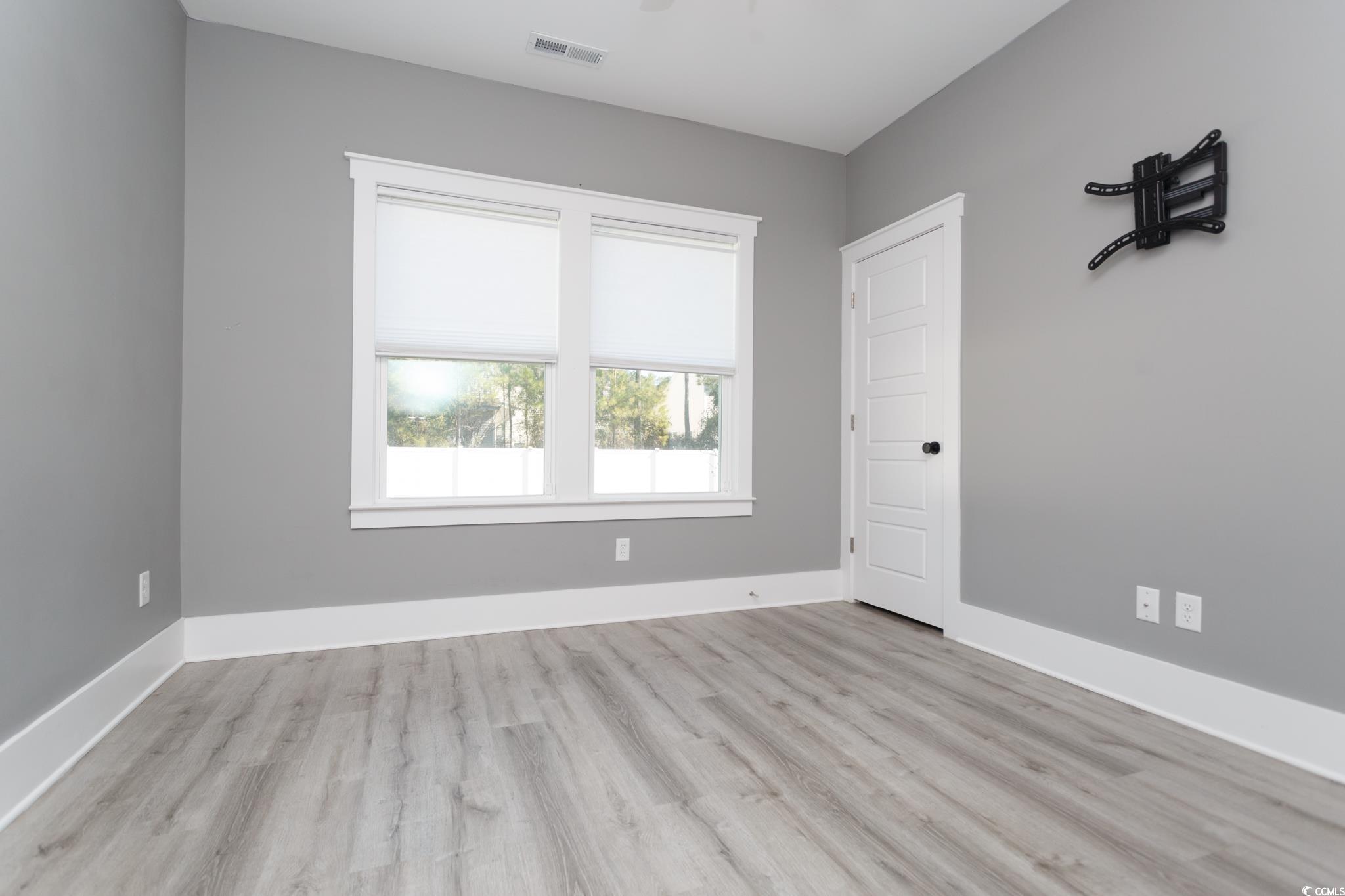 261 Marsh Tacky Loop Myrtle Beach, SC 29588 - Photo 31 of 40 Empty room featuring light wood-type flooring