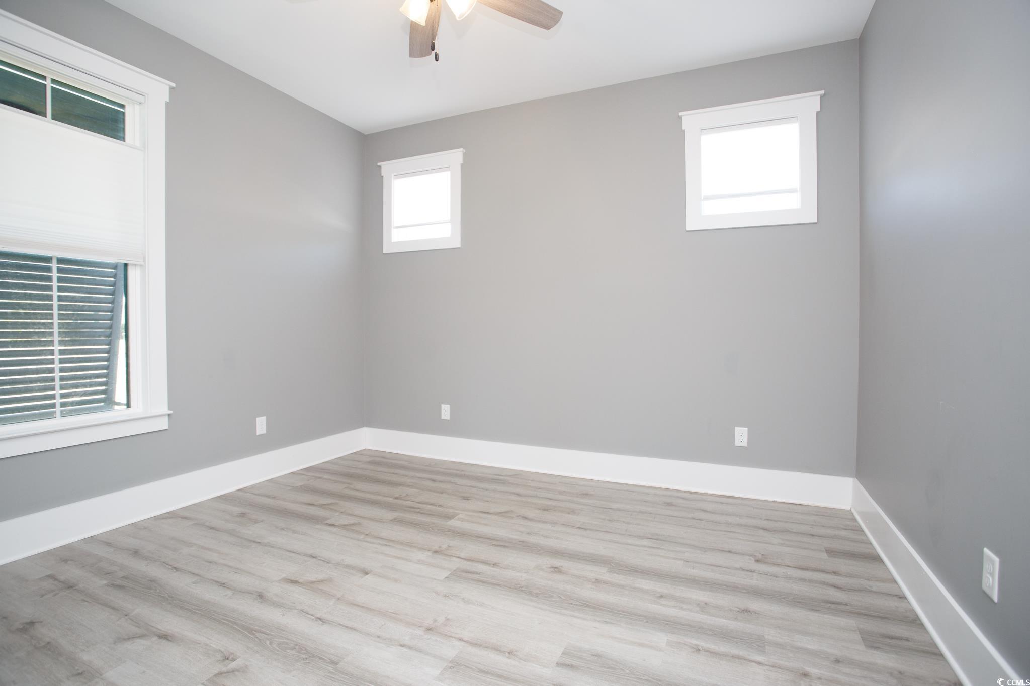 261 Marsh Tacky Loop Myrtle Beach, SC 29588 - Photo 34 of 40 Spare room with ceiling fan and light hardwood / wood-style flooring
