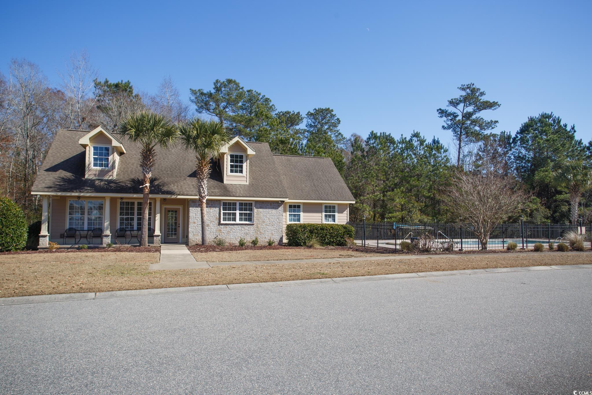261 Marsh Tacky Loop Myrtle Beach, SC 29588 - Photo 38 of 40 Cape cod home featuring a pool