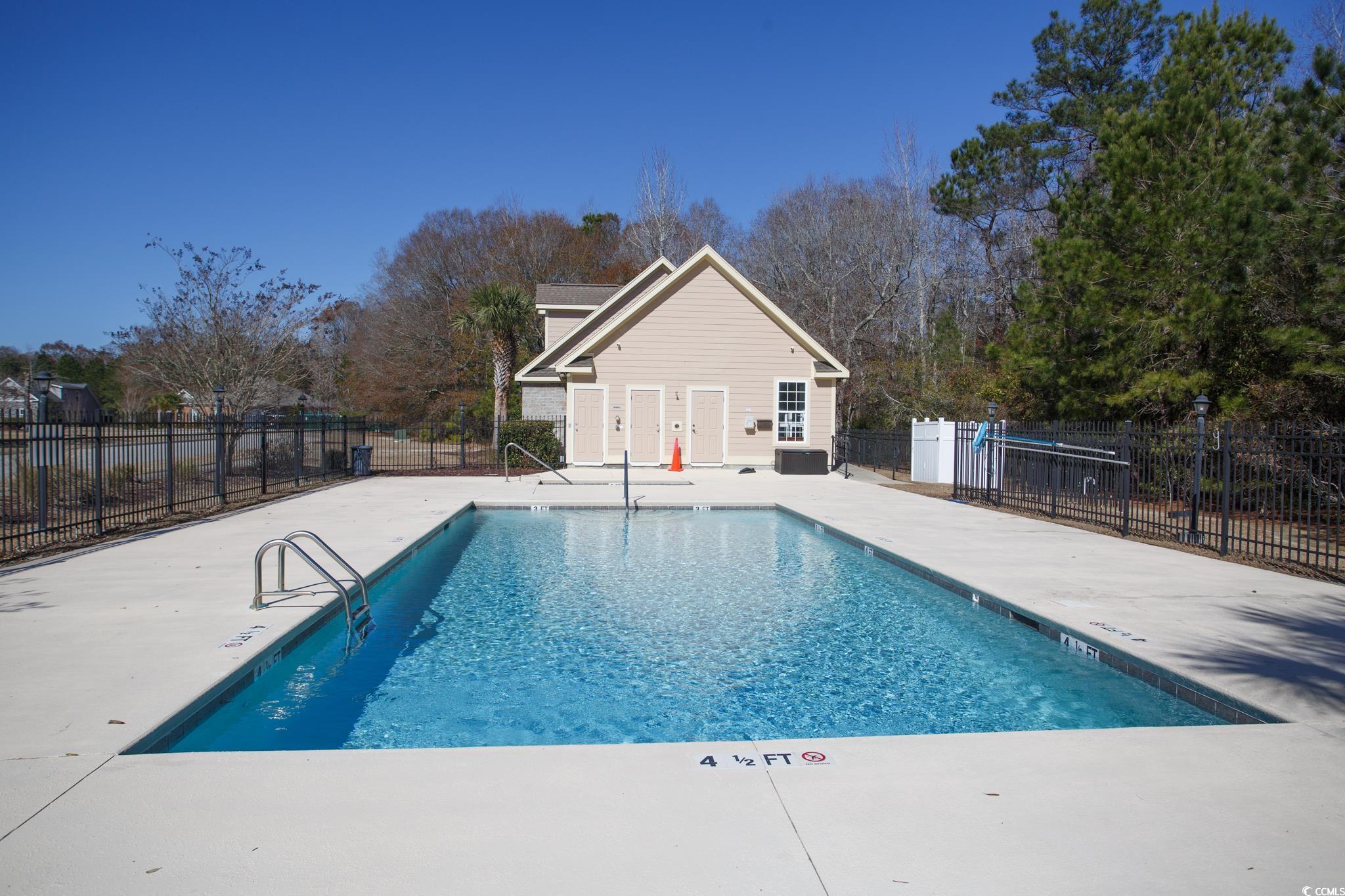 261 Marsh Tacky Loop Myrtle Beach, SC 29588 - Photo 39 of 40 View of swimming pool featuring cooling unit and a patio