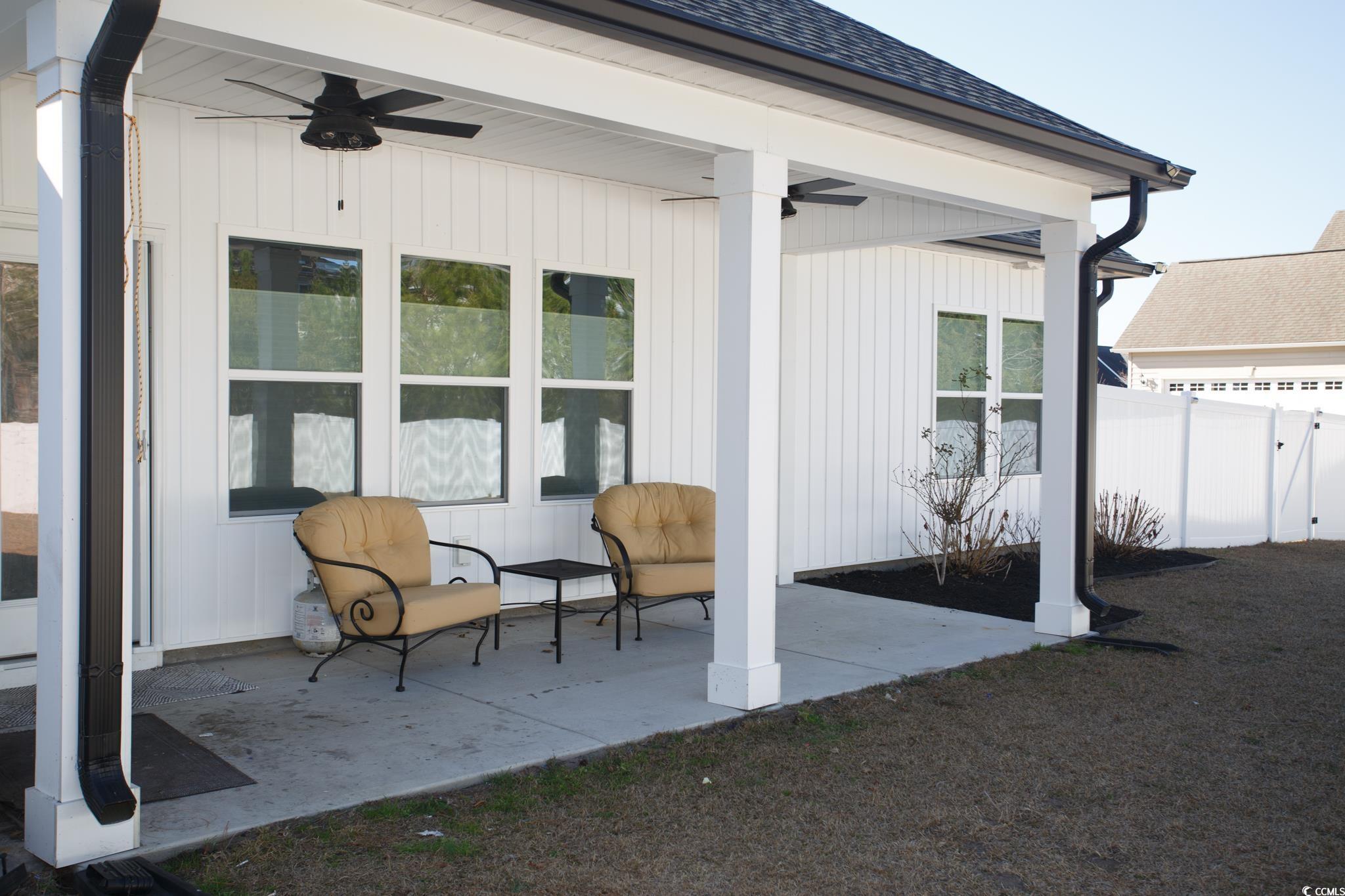 261 Marsh Tacky Loop Myrtle Beach, SC 29588 - Photo 4 of 40 View of patio with ceiling fan