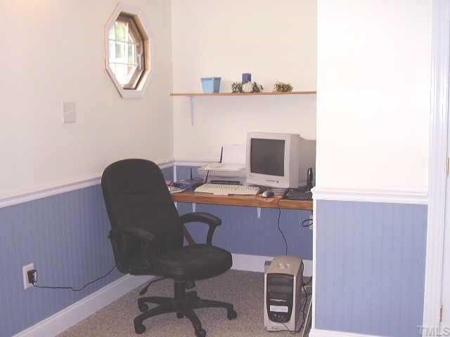 2777 Burlington Road Roxboro, NC 27574 - Photo 5 of 11 a workspace with furniture and a mirror