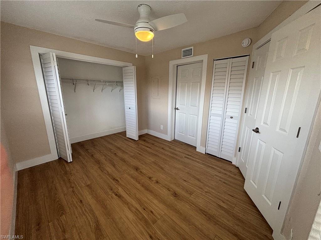 5327 Summerlin Road, Unit 2709 Fort Myers, FL 33919 - Photo 9 of 11 a view of a hallway with wooden floor