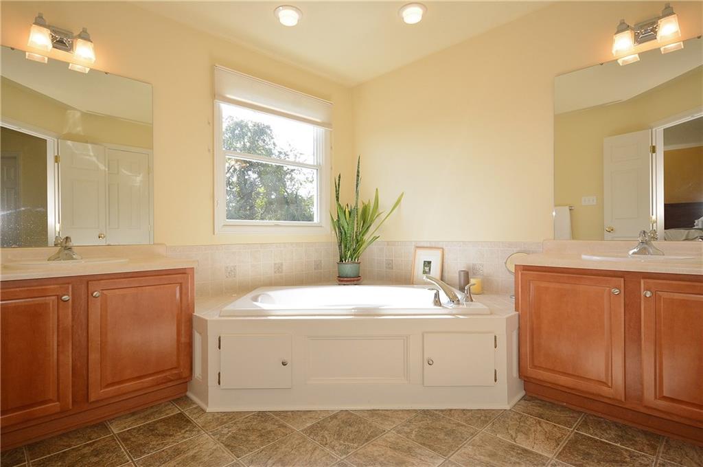 11 Castle View Drive McKees Rocks, PA 15136 - Photo 18 of 25 Master bath configuration upgraded to include larger window, soaker tub, dual sinks and porcelain tile.