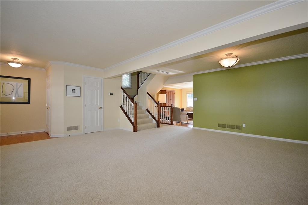 11 Castle View Drive McKees Rocks, PA 15136 - Photo 6 of 25 Open concept dining and living room. Powder room to the left of the stairs.