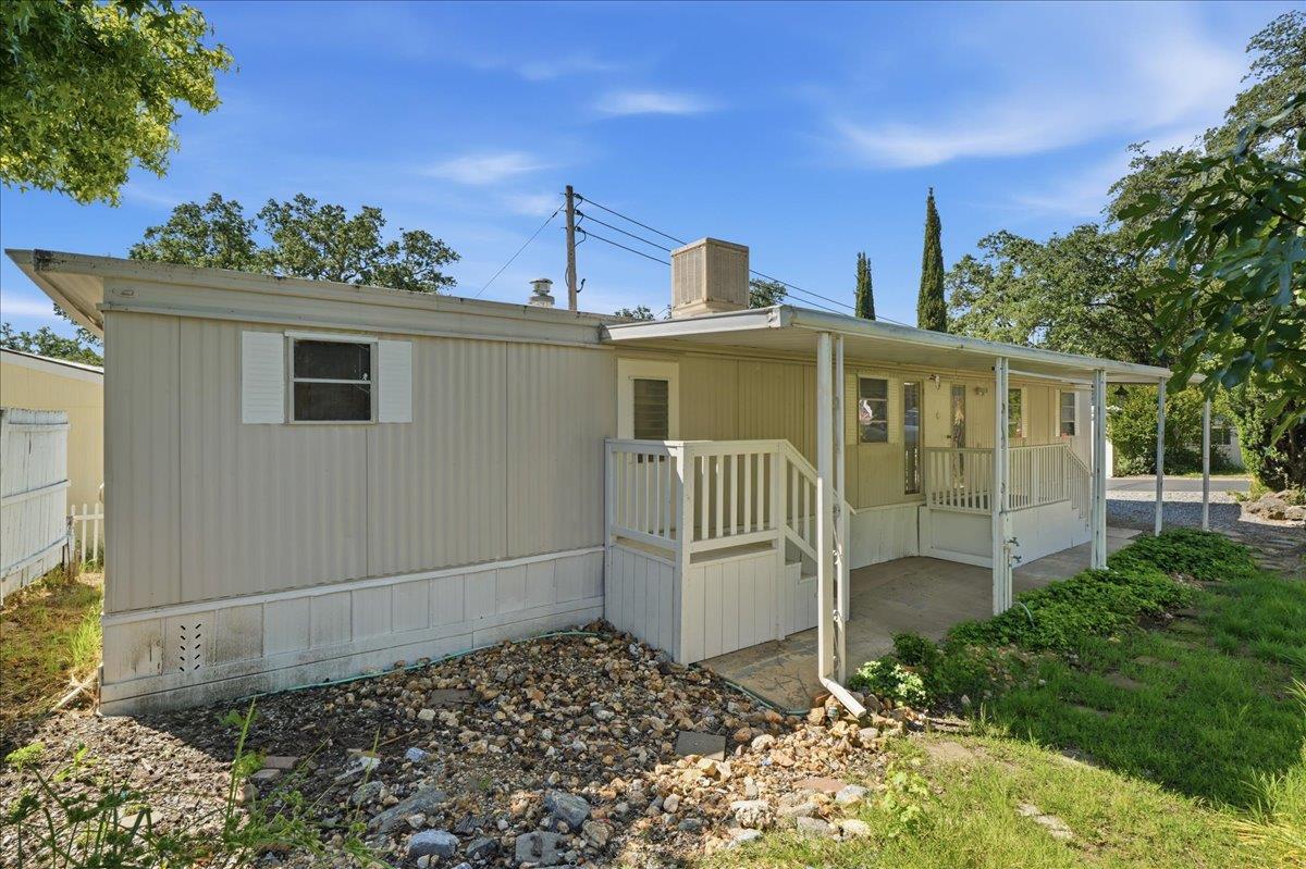1525 Cold Springs Road, Unit 48 Placerville, CA 95667 - Photo 2 of 23 a view of a house with a yard and potted plants