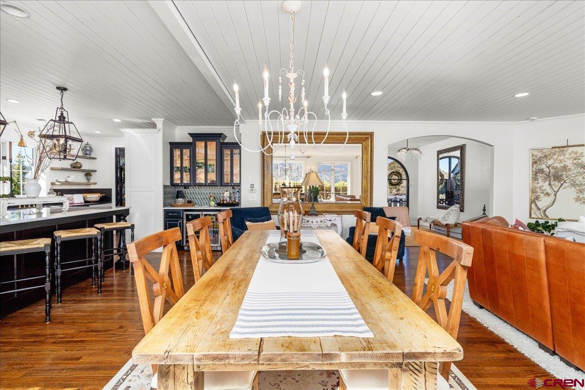 240 Vista Drive Ridgway, CO 81432 - Photo 11 of 41 a dining room with wooden floor and large windows