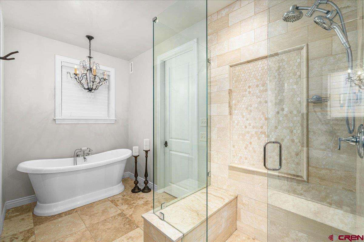 240 Vista Drive Ridgway, CO 81432 - Photo 22 of 41 a bathroom with a white tub and shower