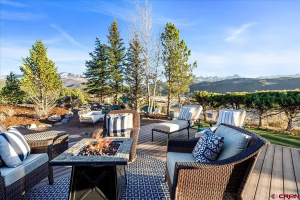 a outdoor living space with furniture and a fireplace