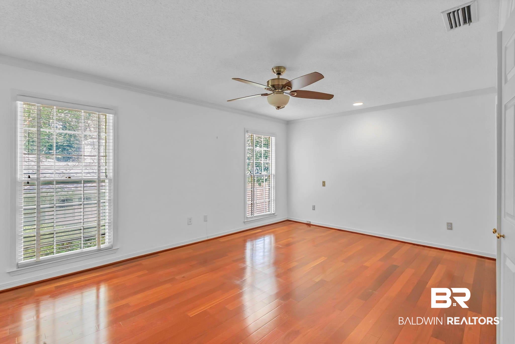 309 West Brandy Run Road Mobile, AL 36608 - Photo 36 of 100 Empty room featuring wood finished floors, ornamental molding, and ceiling fan