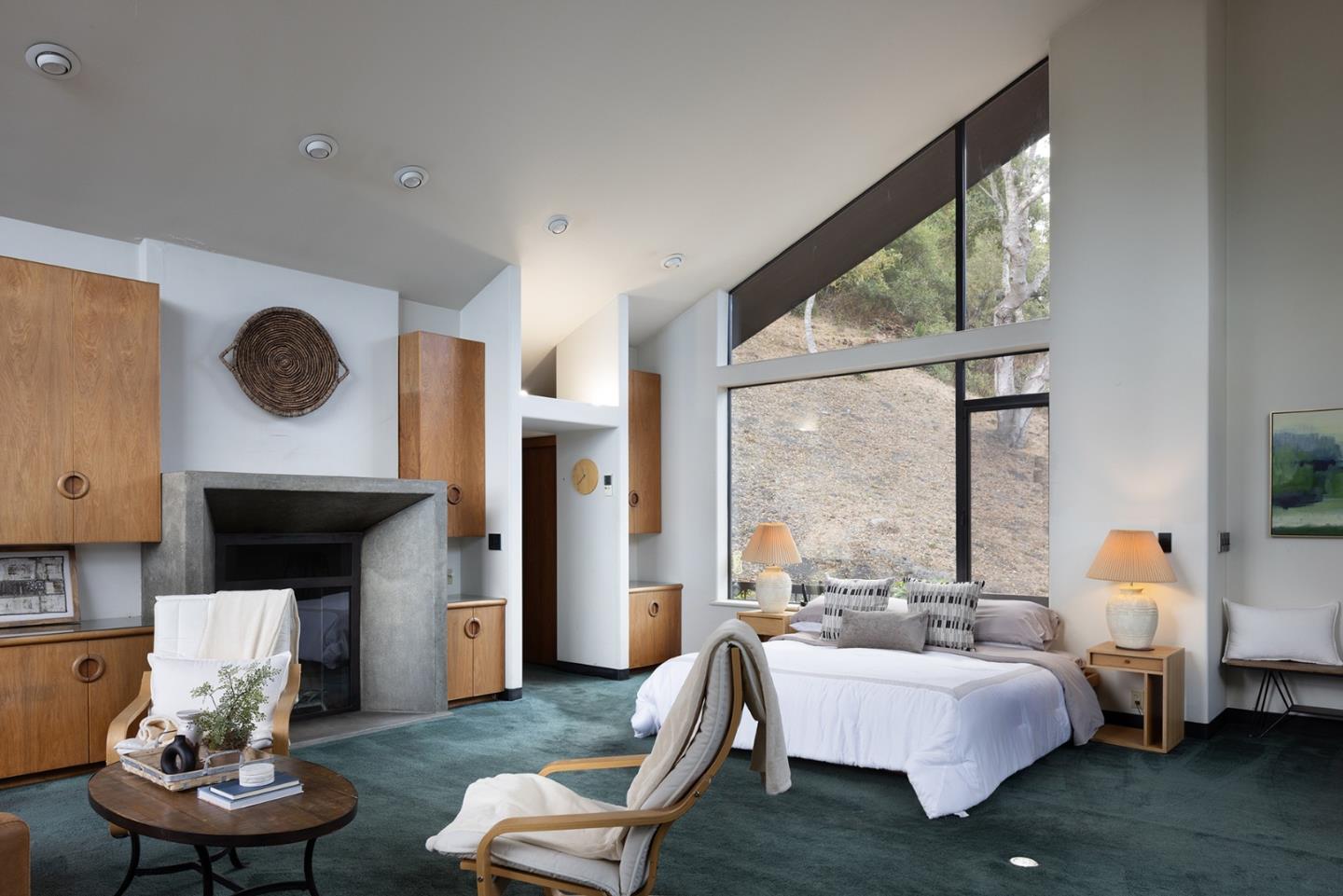 571 Viejo Road Carmel, CA 93923 - Photo 16 of 41 a living room with furniture a fireplace and large windows