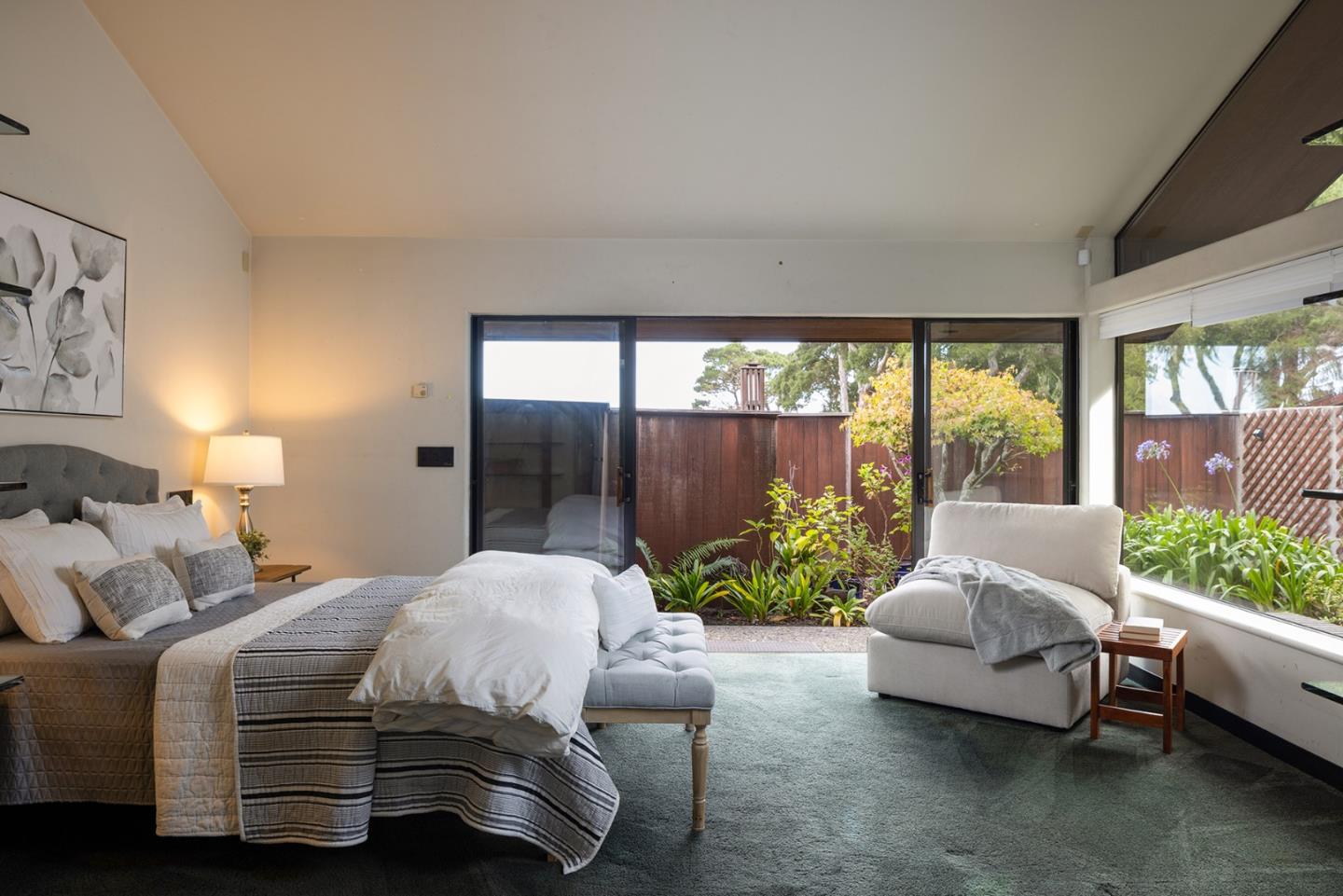 571 Viejo Road Carmel, CA 93923 - Photo 19 of 41 a bedroom with a bed and large windows