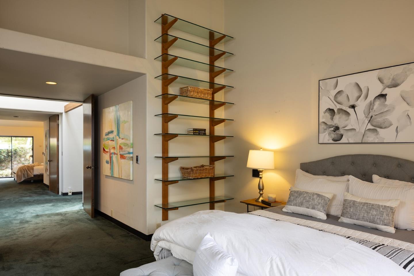 571 Viejo Road Carmel, CA 93923 - Photo 20 of 41 a bedroom with a bed and a painting on the wall