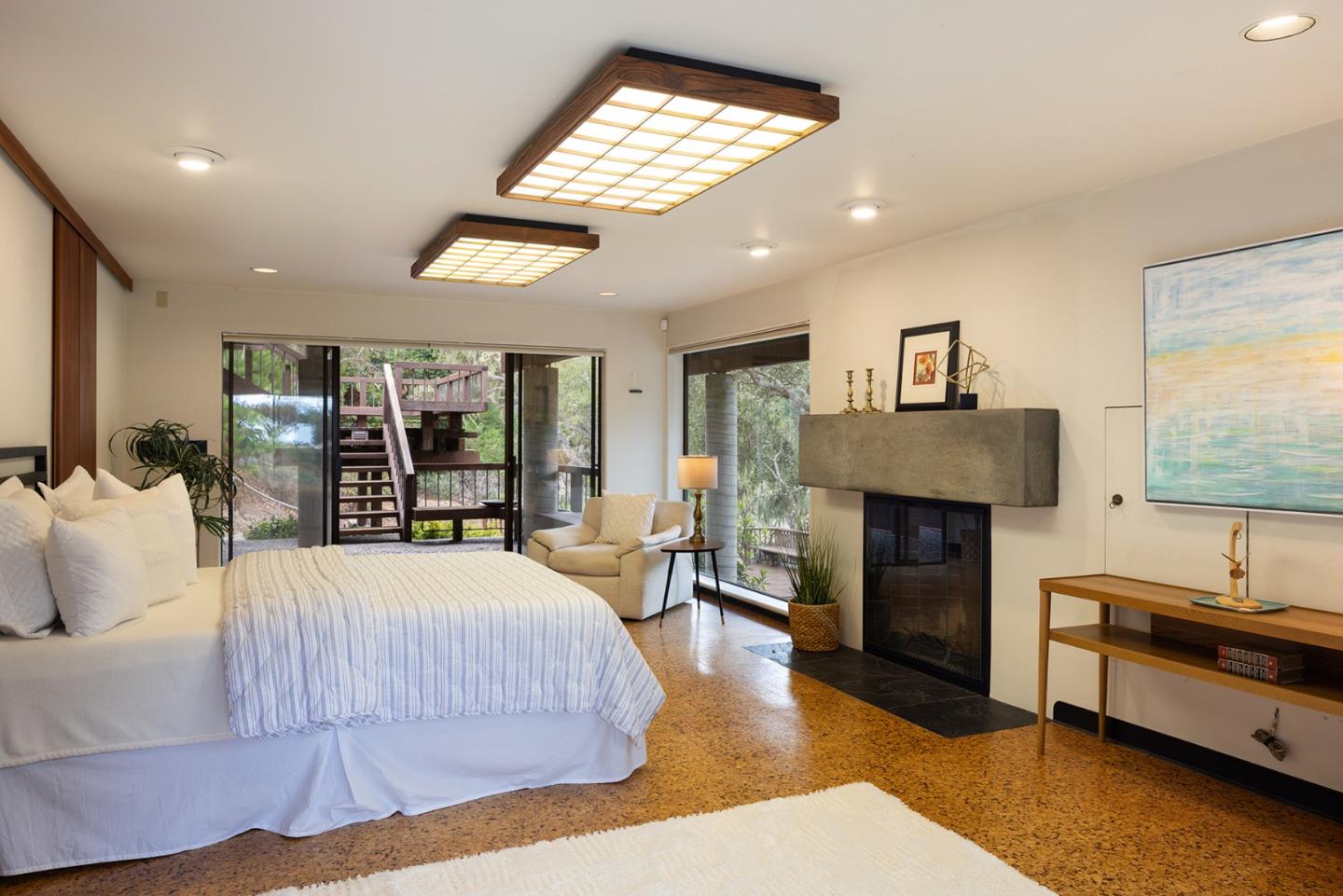 571 Viejo Road Carmel, CA 93923 - Photo 24 of 41 a bedroom with a bed and a fireplace