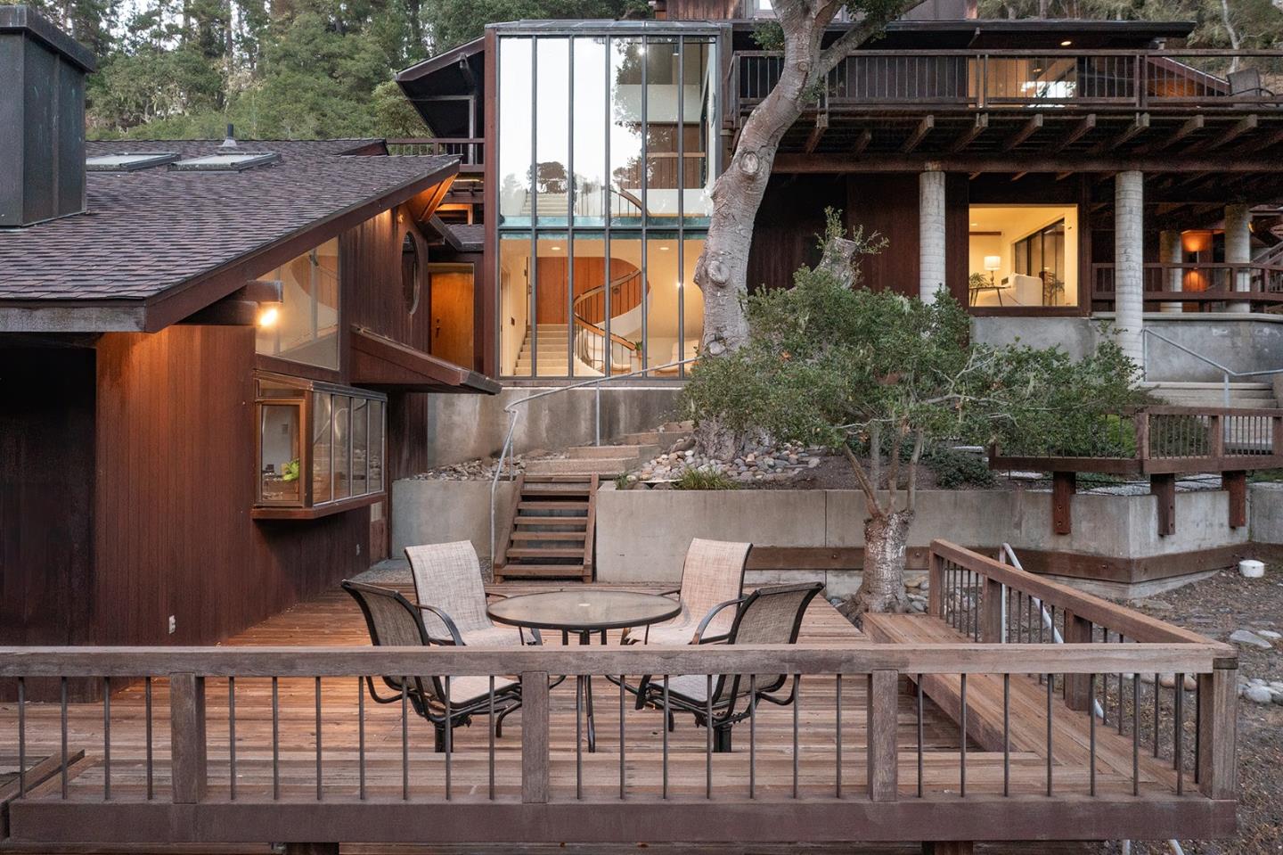 571 Viejo Road Carmel, CA 93923 - Photo 37 of 41 a balcony of a house with wooden floor and outdoor seating