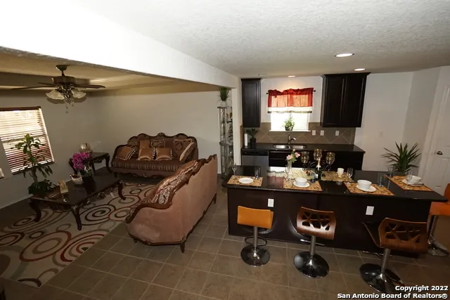 a room with gym equipment and a flat screen tv