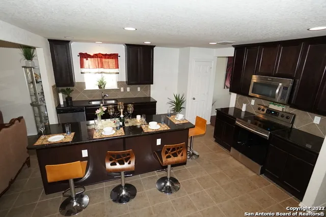 a room with furniture and a flat screen tv