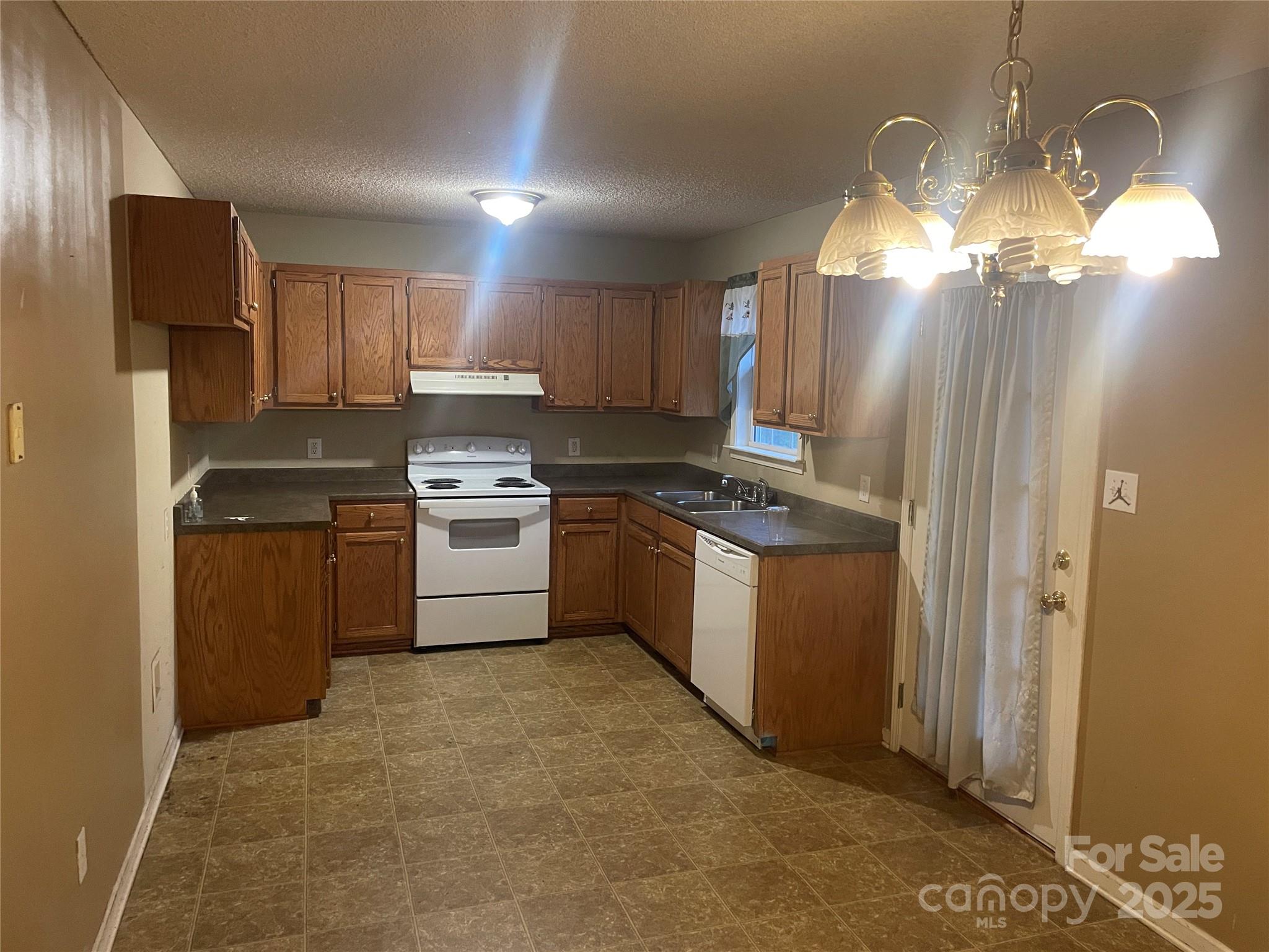 112 Ridgewood Lane York, SC 29745 - Photo 3 of 15 a kitchen with cabinets a sink and stainless steel appliances
