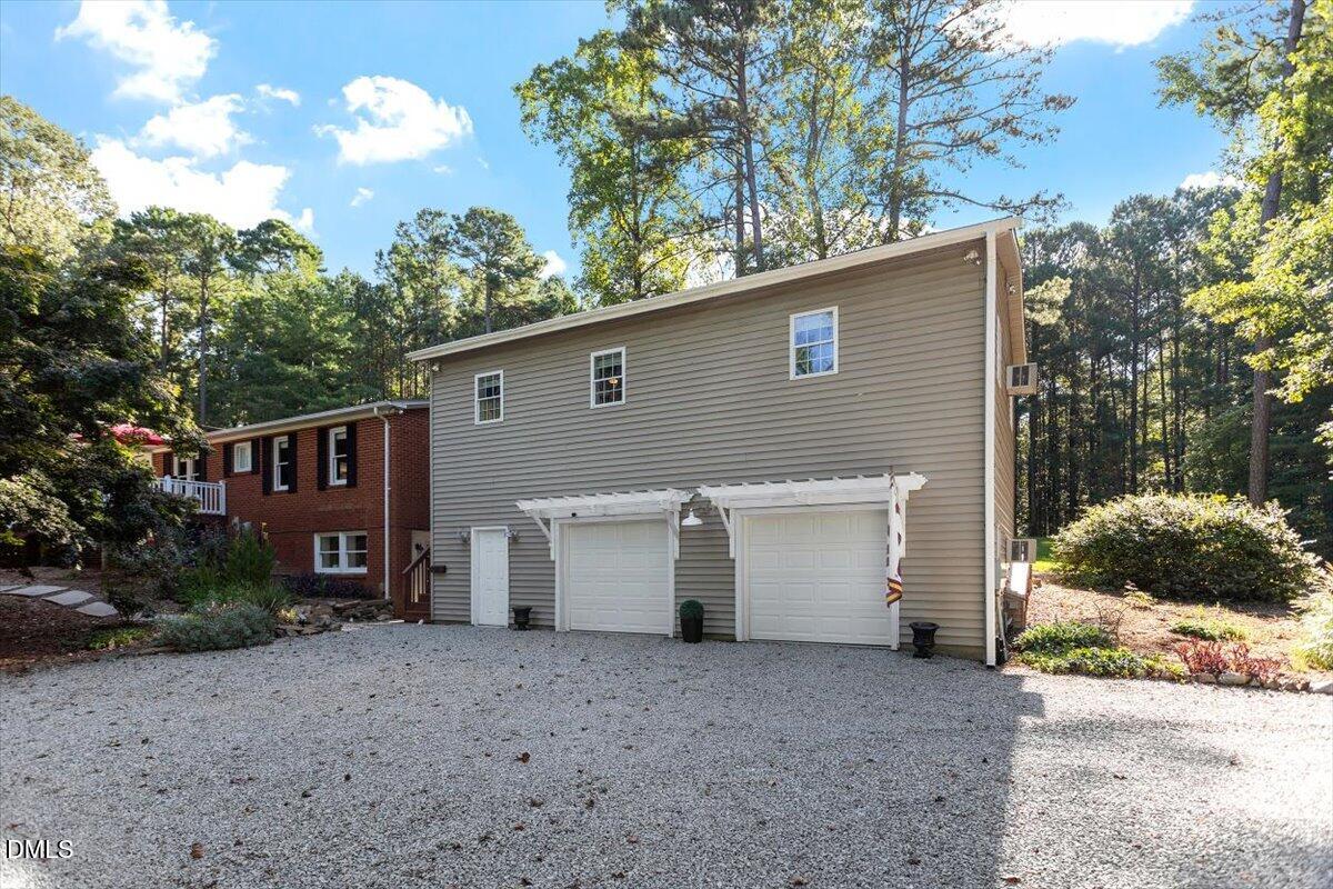 2129 Kelly Road Apex, NC 27502 - Photo 4 of 64 a view of a house with a backyard