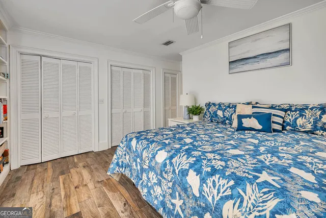 a bedroom with a bed and a closet