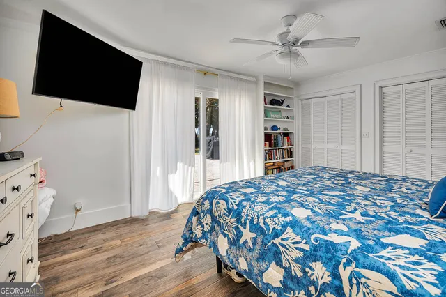 a bathroom with a granite countertop toilet and a sink