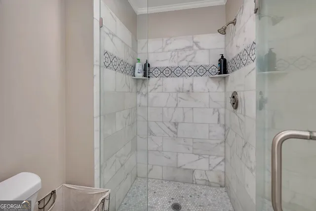 a bathroom with a sink toilet and mirror