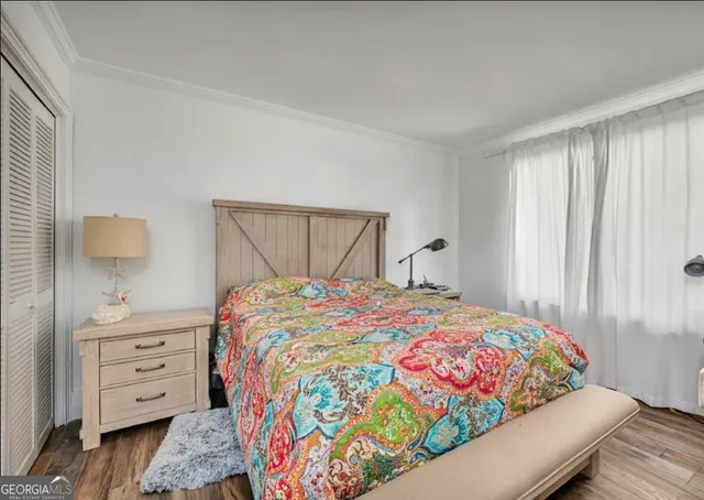 a bedroom with bed and window