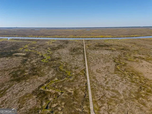 an aerial view of a house with outdoor space