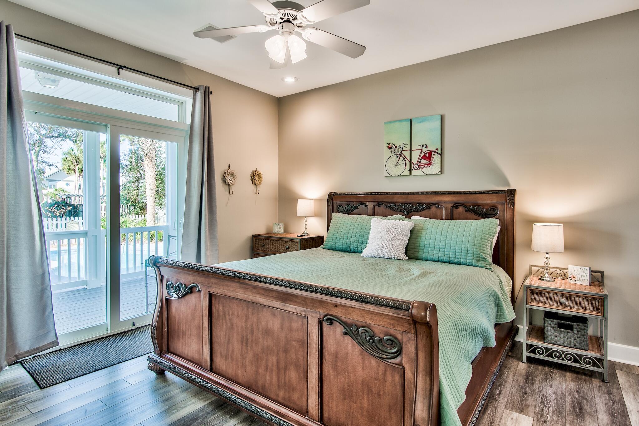 4489 Ocean View Drive Destin, FL 32541 - Photo 16 of 61 a bedroom with a bed and wooden floor