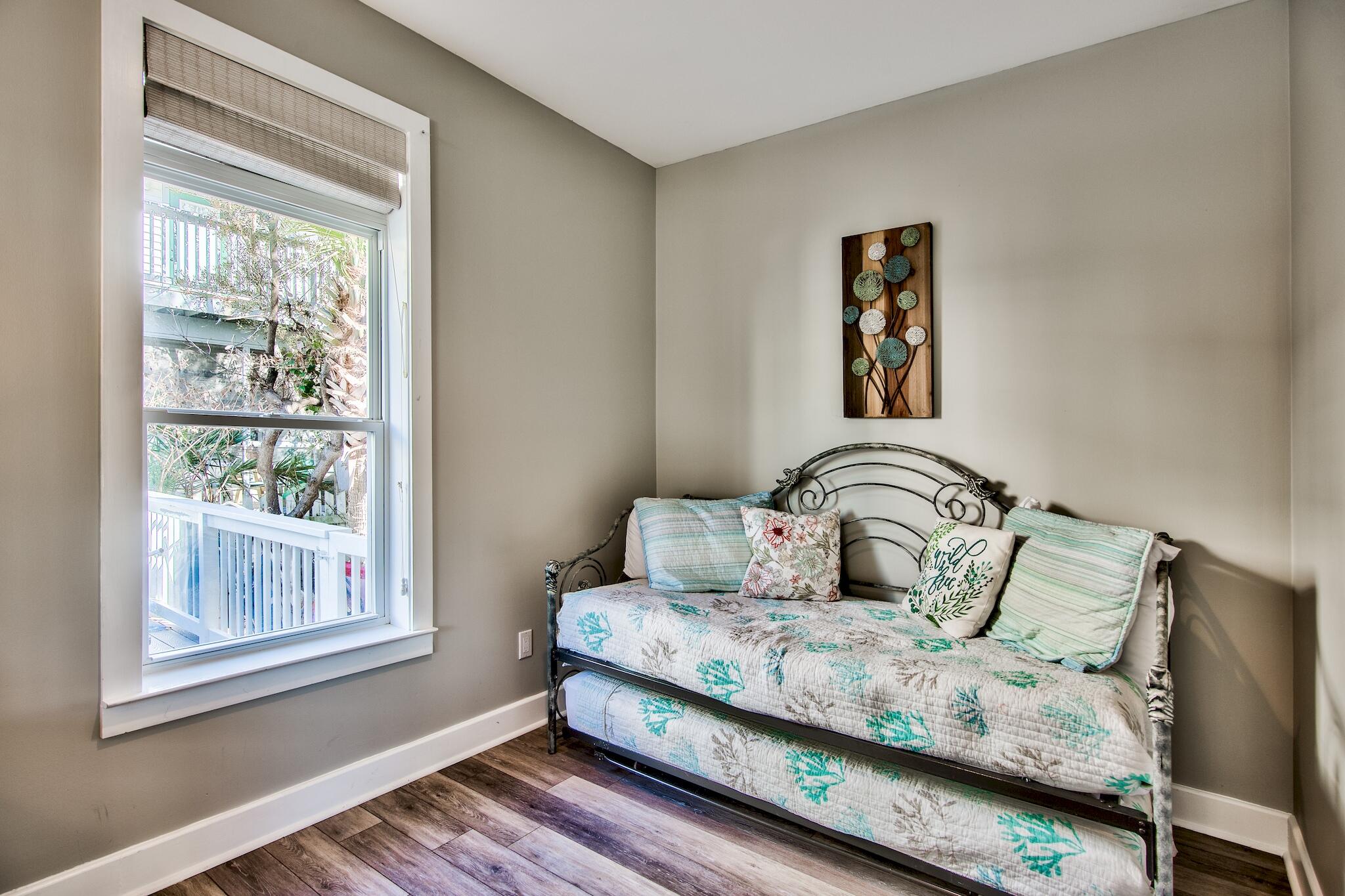 4489 Ocean View Drive Destin, FL 32541 - Photo 18 of 61 a bedroom with bed and wooden floor