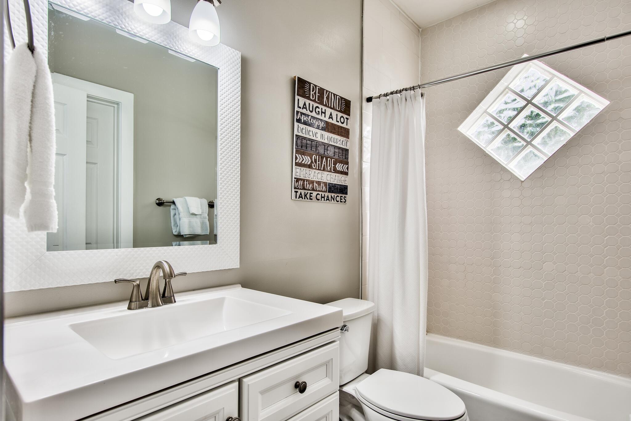4489 Ocean View Drive Destin, FL 32541 - Photo 19 of 61 a bathroom with a sink toilet and shower