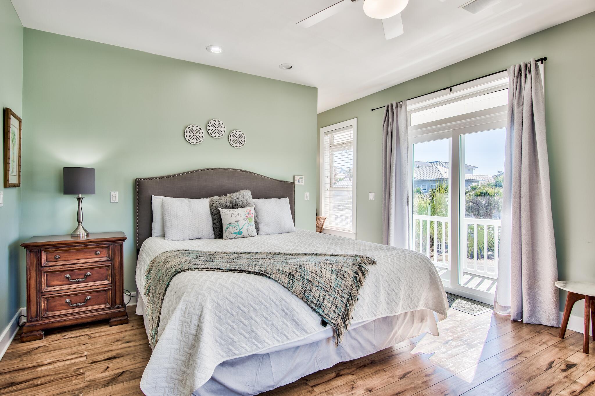 4489 Ocean View Drive Destin, FL 32541 - Photo 21 of 61 a bedroom with a bed and wooden floor