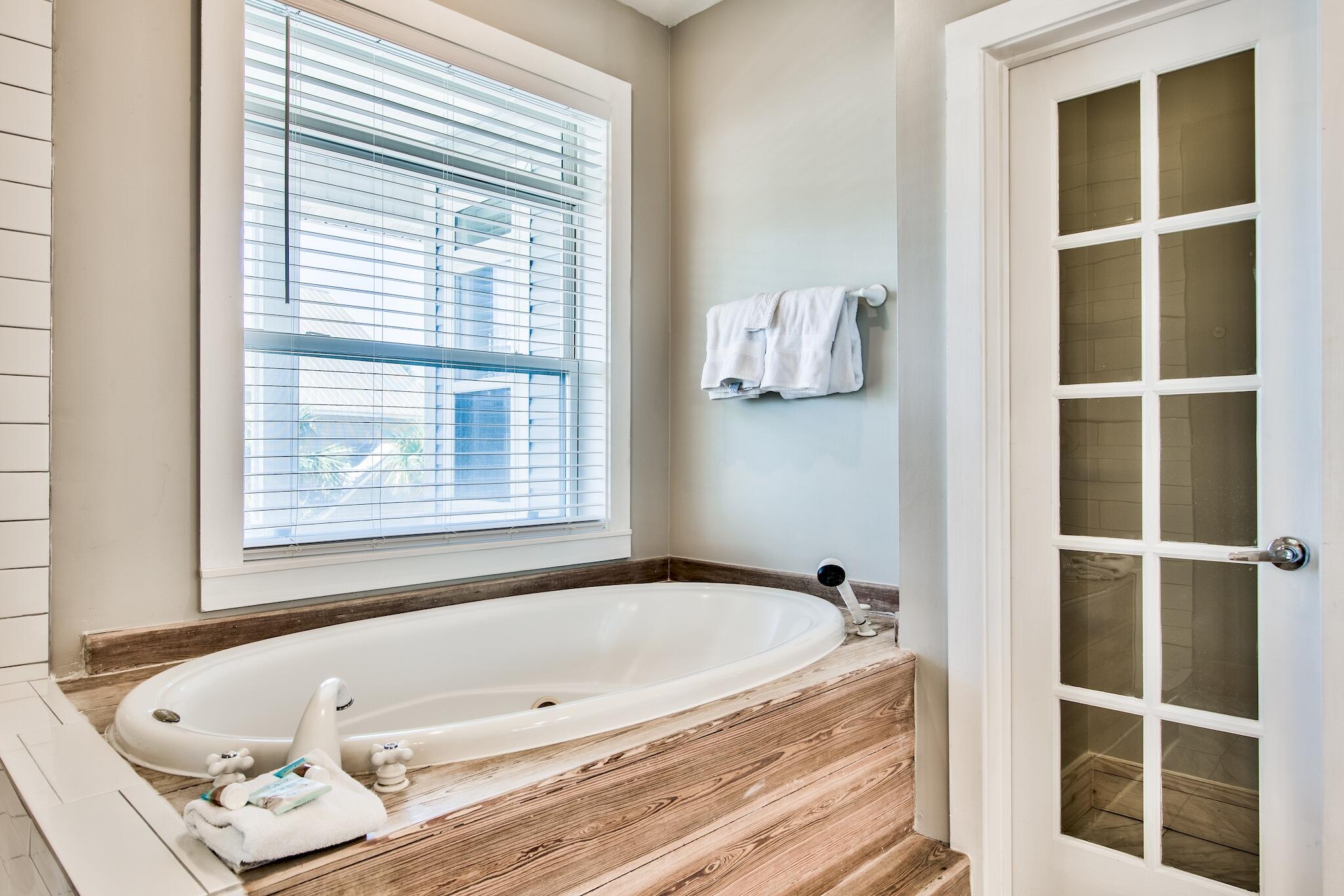 4489 Ocean View Drive Destin, FL 32541 - Photo 25 of 61 a bathroom with a tub and a window