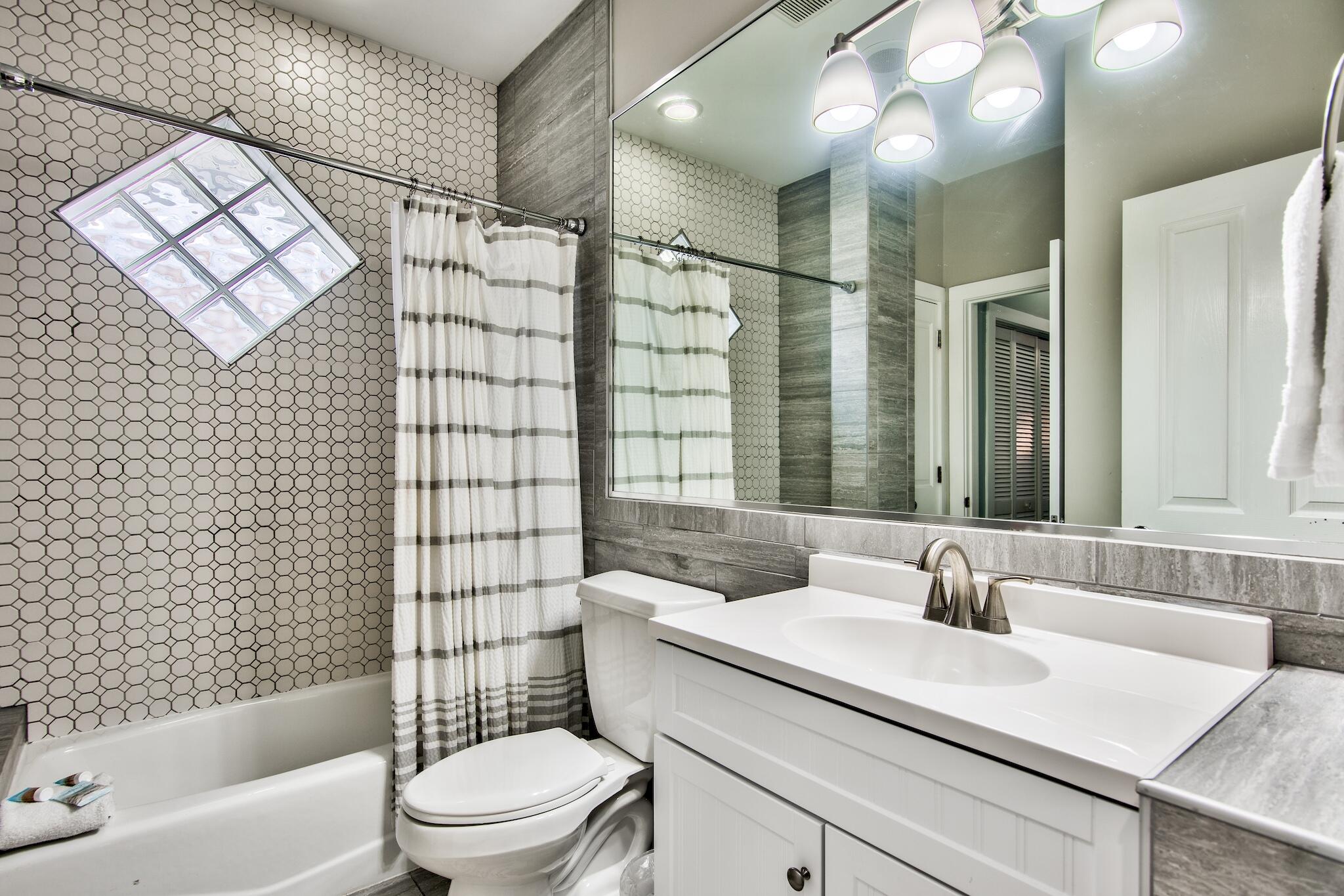 4489 Ocean View Drive Destin, FL 32541 - Photo 35 of 61 a bathroom with a sink toilet vanity and shower