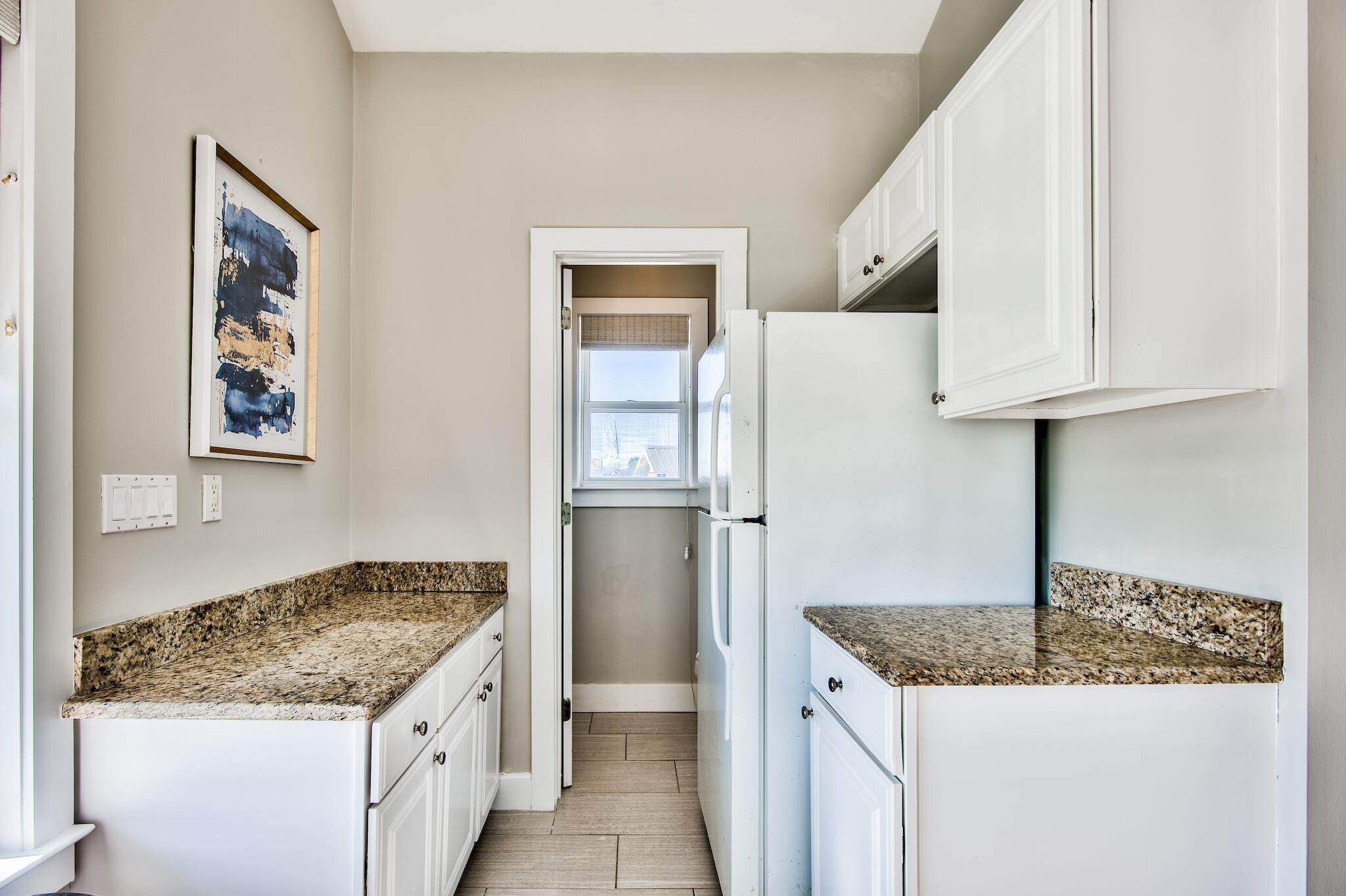 4489 Ocean View Drive Destin, FL 32541 - Photo 39 of 61 a kitchen with stainless steel appliances granite countertop a refrigerator and a stove