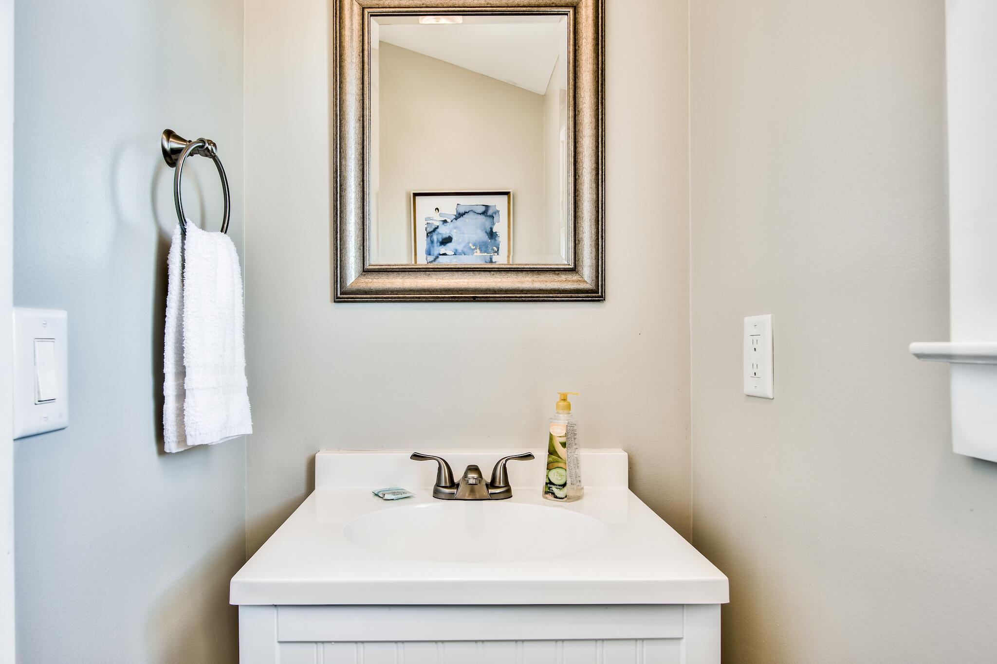 4489 Ocean View Drive Destin, FL 32541 - Photo 40 of 61 a bathroom with a sink and a mirror