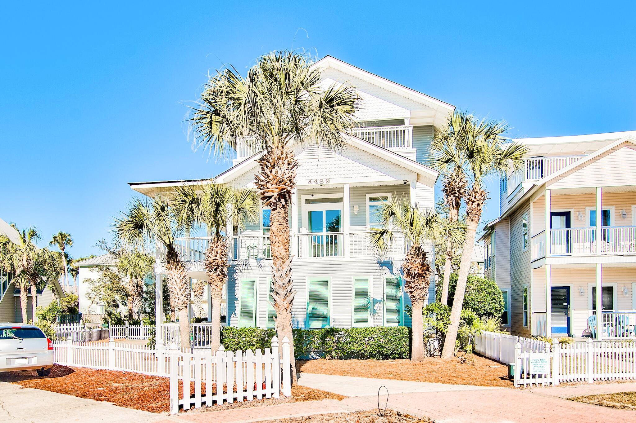 4489 Ocean View Drive Destin, FL 32541 - Photo 56 of 61 a front view of a building with a garden