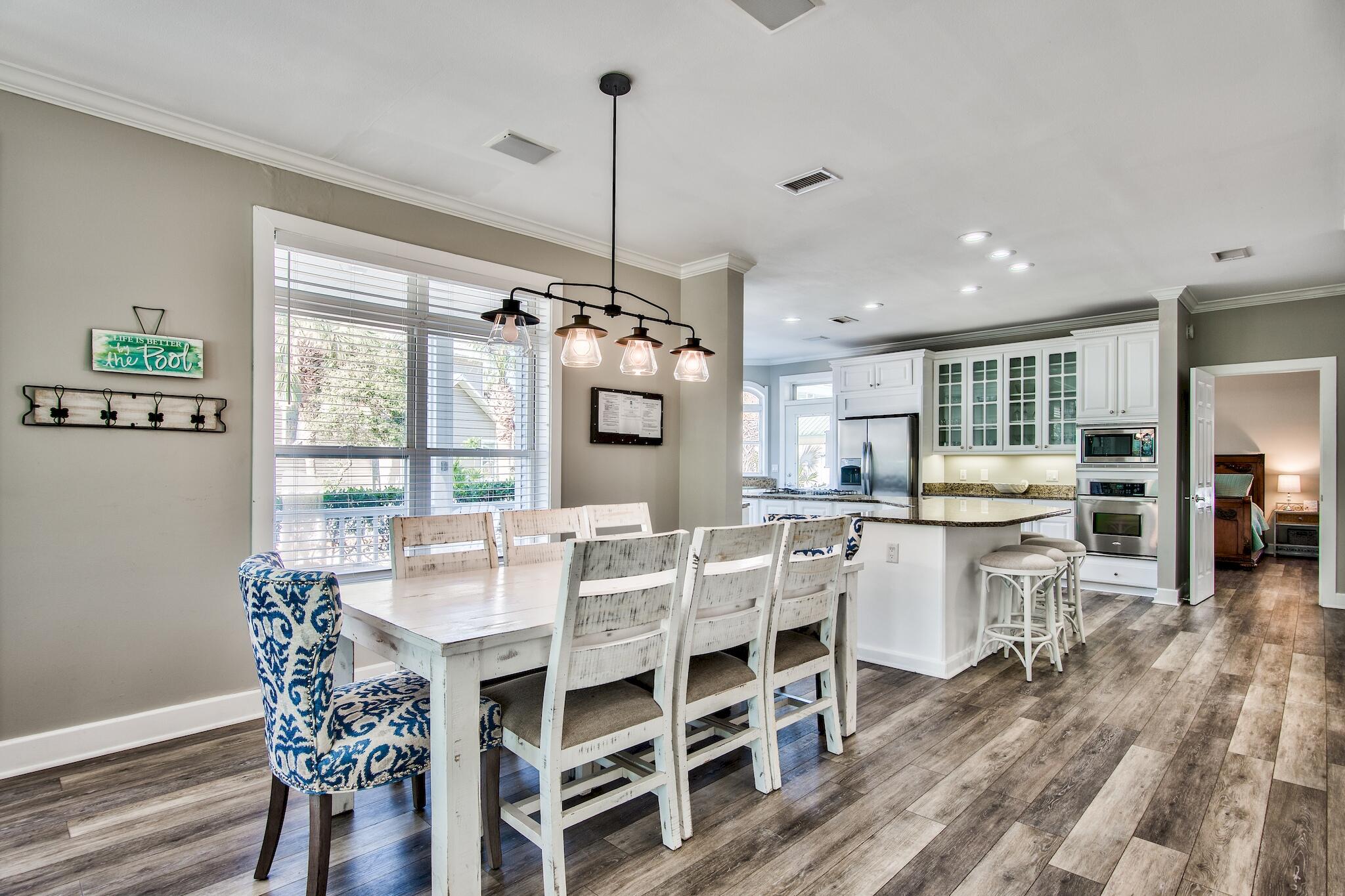 4489 Ocean View Drive Destin, FL 32541 - Photo 8 of 61 a view of a dining room with furniture window and wooden floor