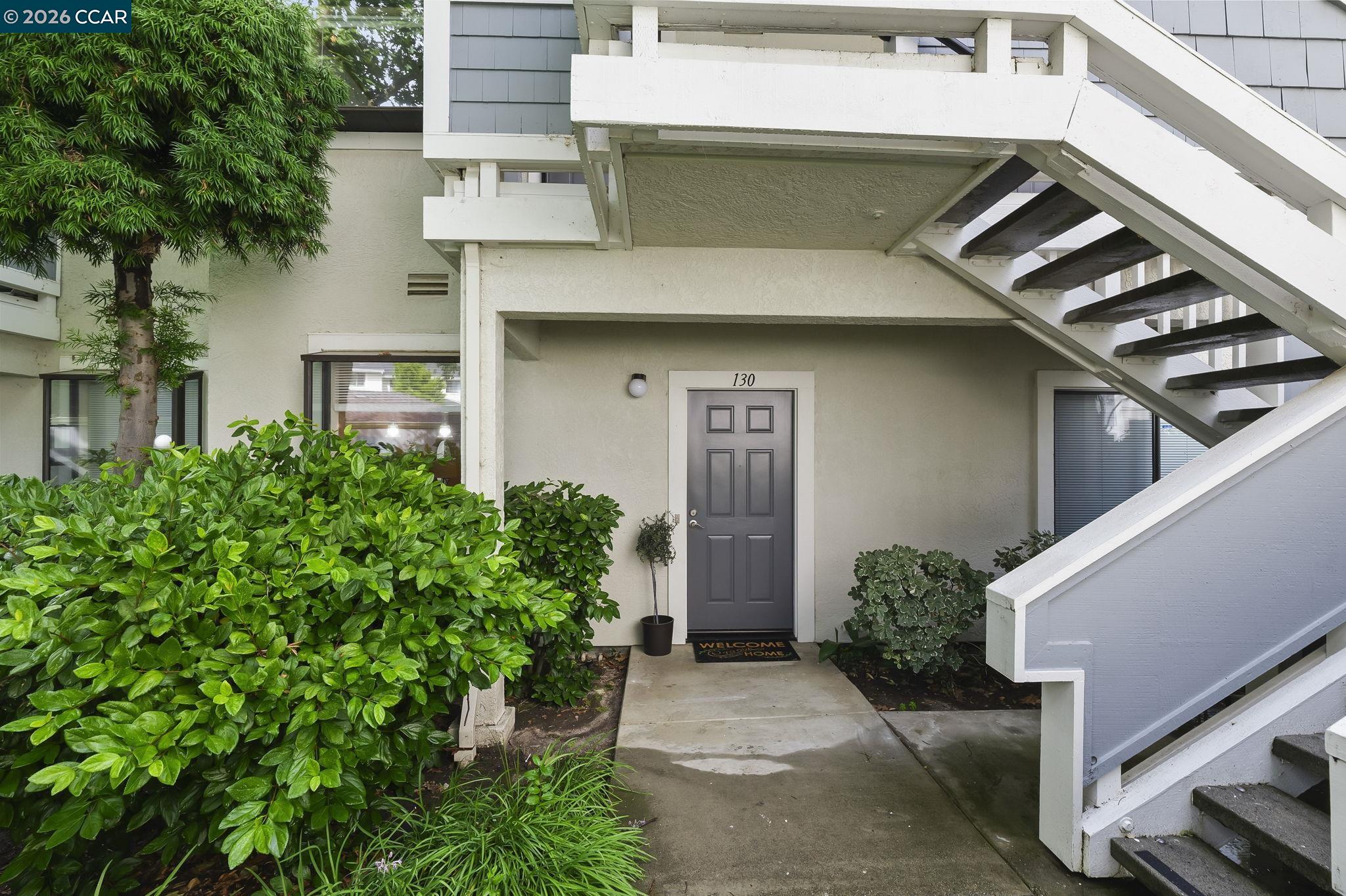2586 Oak Road, Unit 130 Walnut Creek, CA 94597 - Photo 2 of 31 a front view of a house with plants
