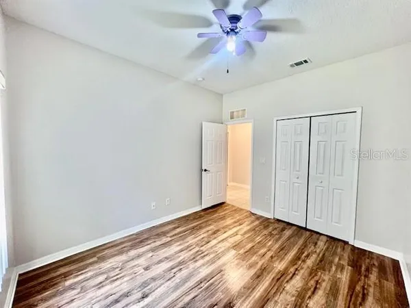 a living room with furniture pool table and windows
