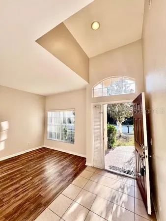 a kitchen with stainless steel appliances granite countertop a sink a stove a refrigerator a microwave and cabinets