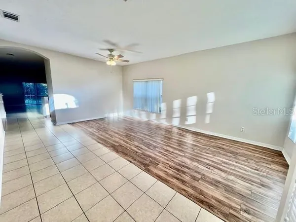 a kitchen with stainless steel appliances granite countertop a sink a stove a microwave and cabinets