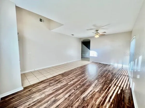 a kitchen with granite countertop a refrigerator and a sink