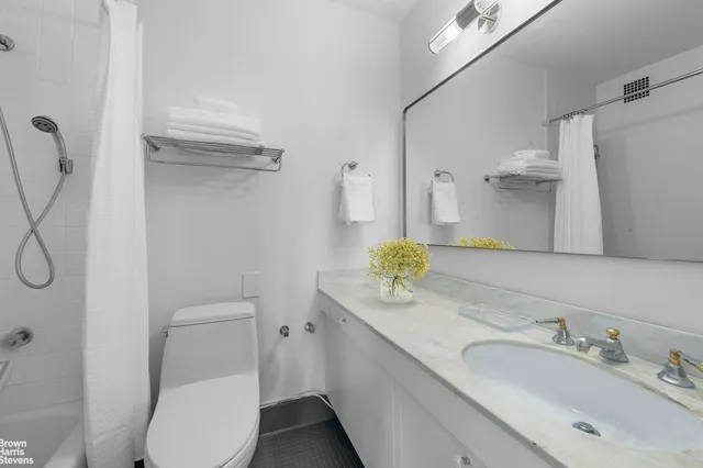 a large white bed in a white room