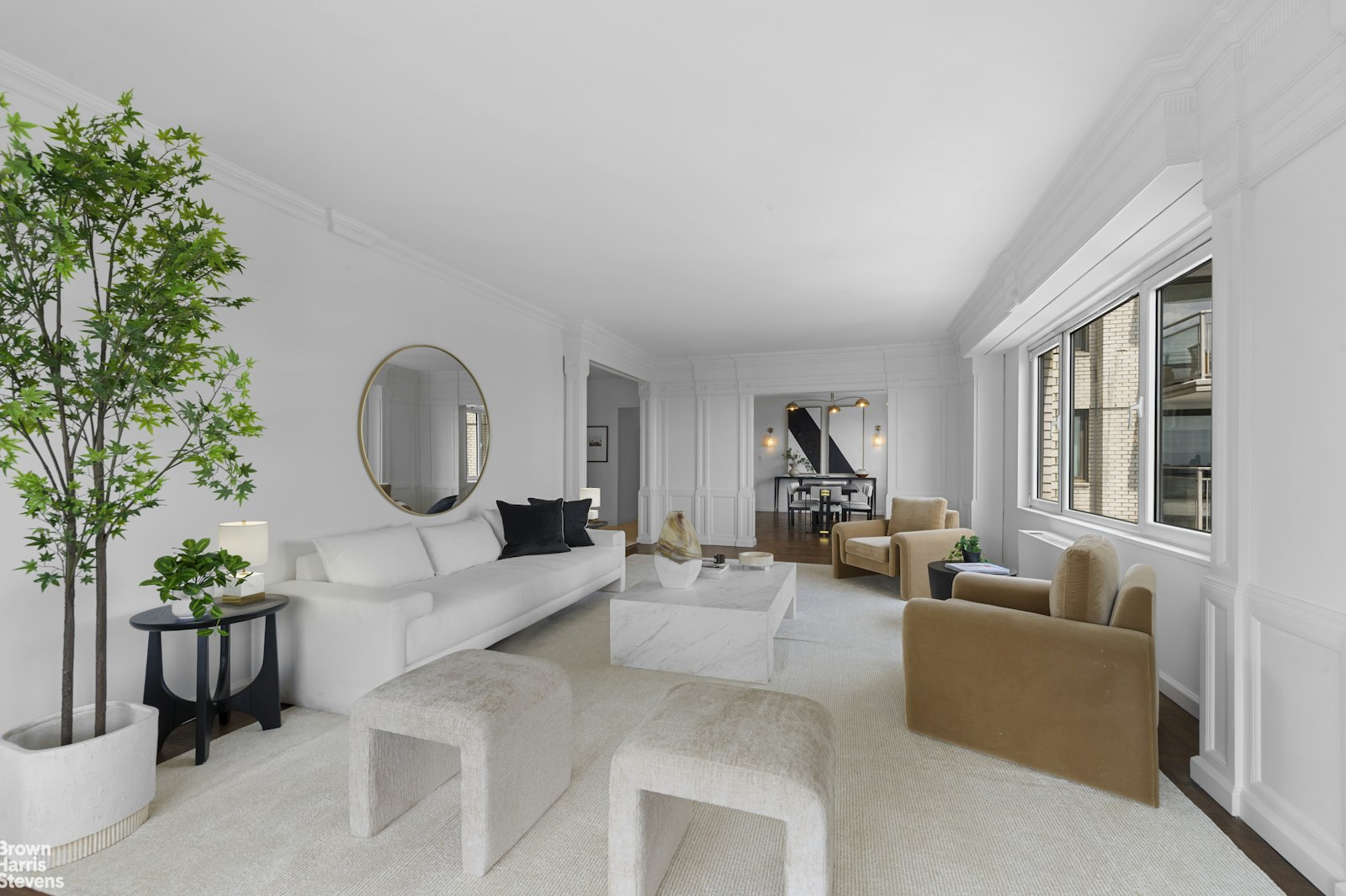303 East 57th Street, Unit 39A Manhattan, NY 10022 - Photo 2 of 16 a living room with furniture and a potted plant