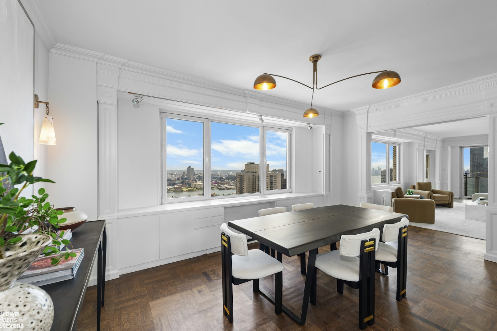 303 East 57th Street, Unit 39A Manhattan, NY 10022 - Photo 3 of 16 a view of a dining room with furniture and a potted plants