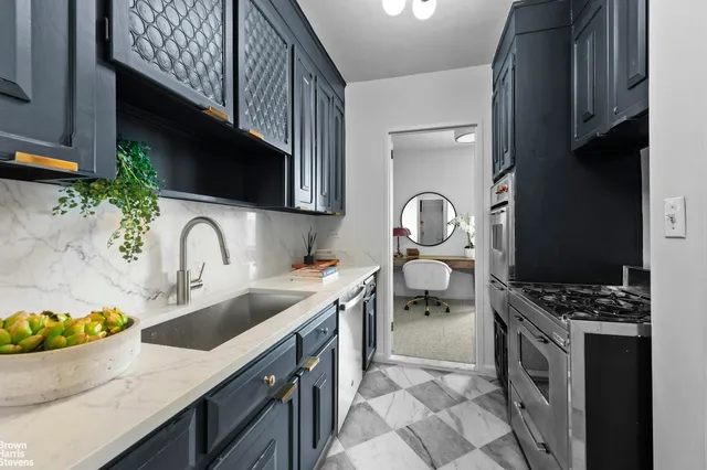 a view of a livingroom with furniture and a window