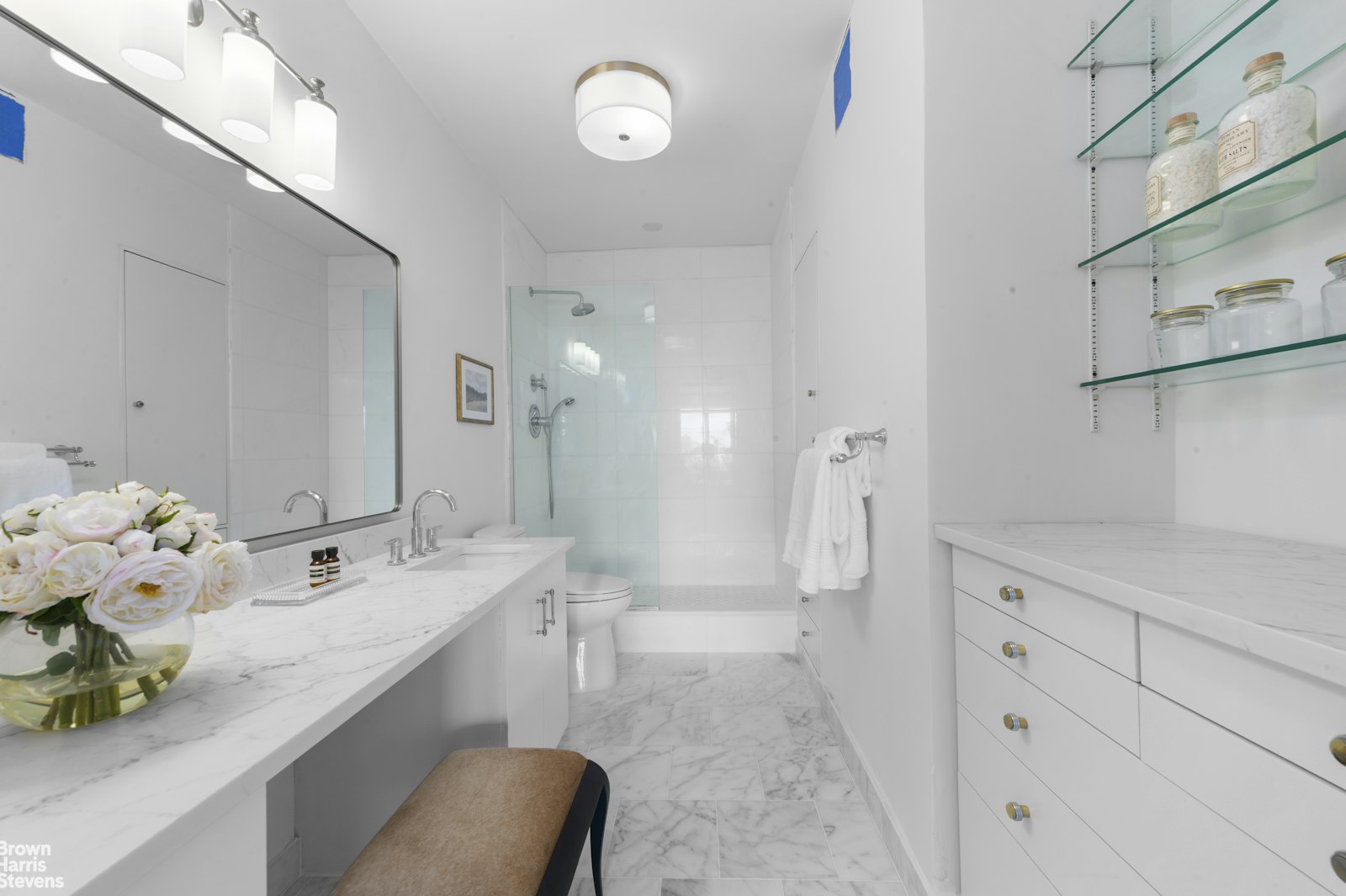 303 East 57th Street, Unit 39A Manhattan, NY 10022 - Photo 9 of 16 a bathroom with a double vanity sink mirror and shower