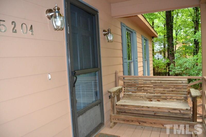 5204 Country Trail Raleigh, NC 27613 - Photo 3 of 23 a view of wooden door